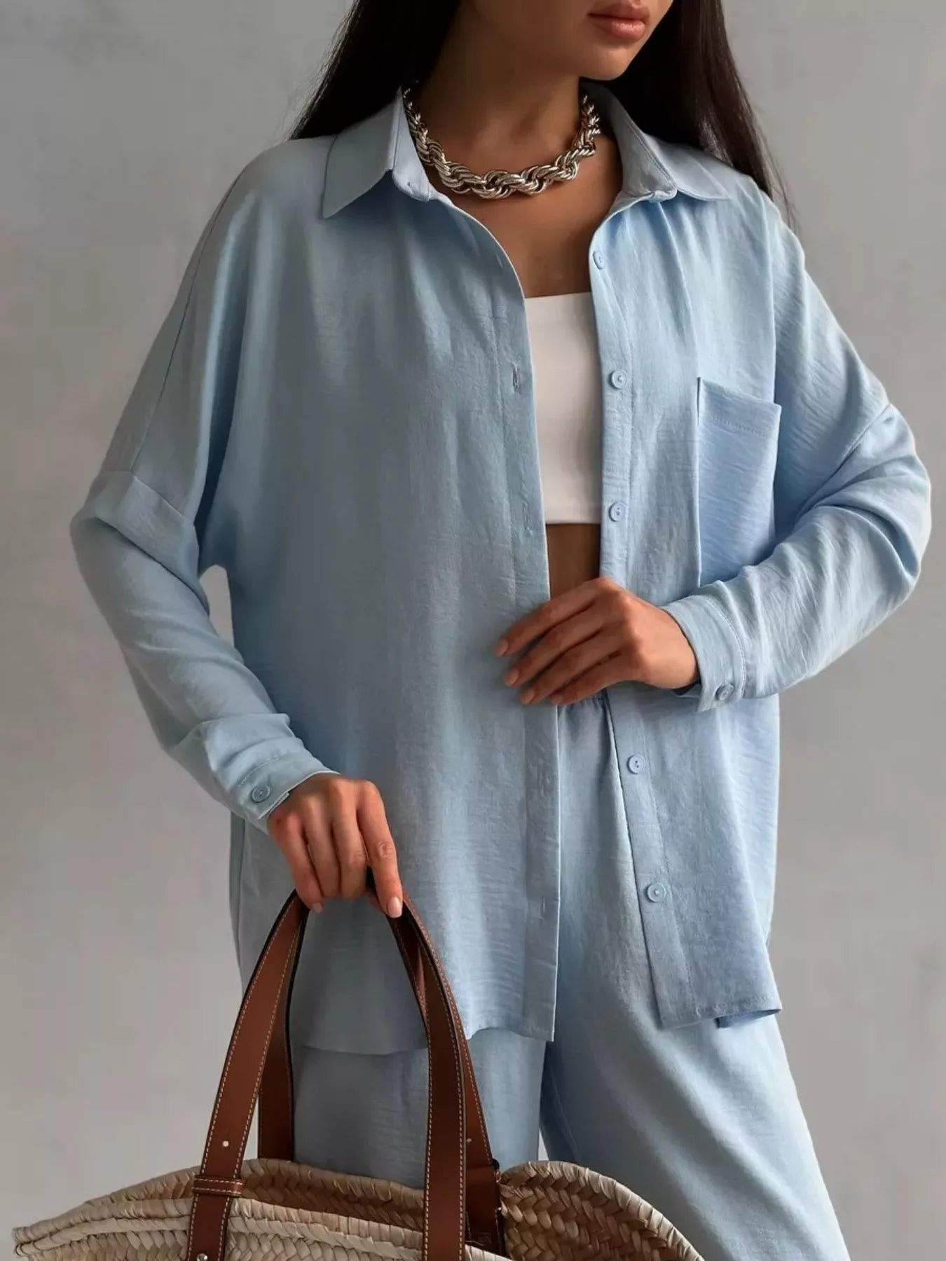 Light blue button-up relaxed-fit shirt with matching wide-leg pants, elastic waist