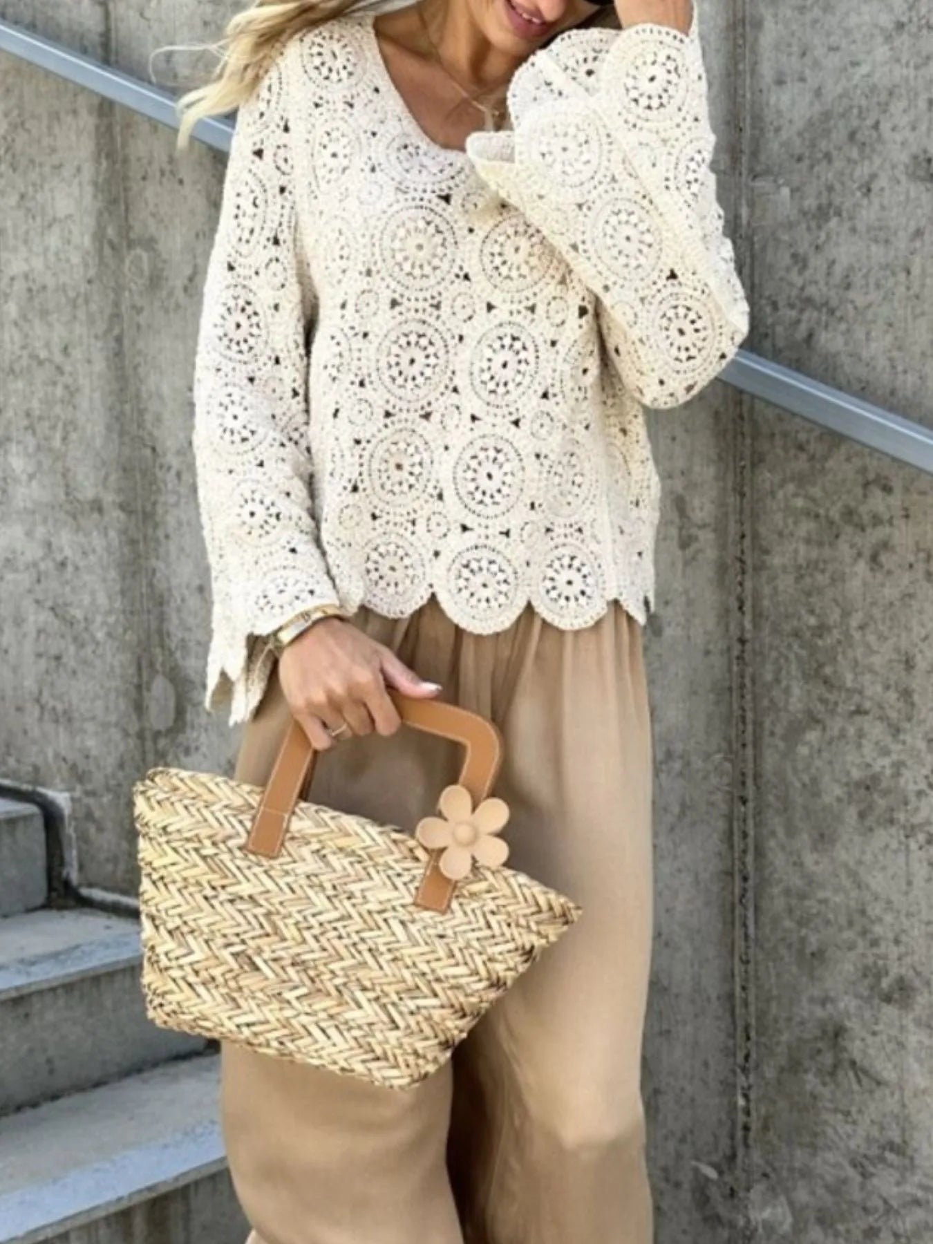 White crochet lace knit top with V-neck, long sleeves, and scalloped bottom edge