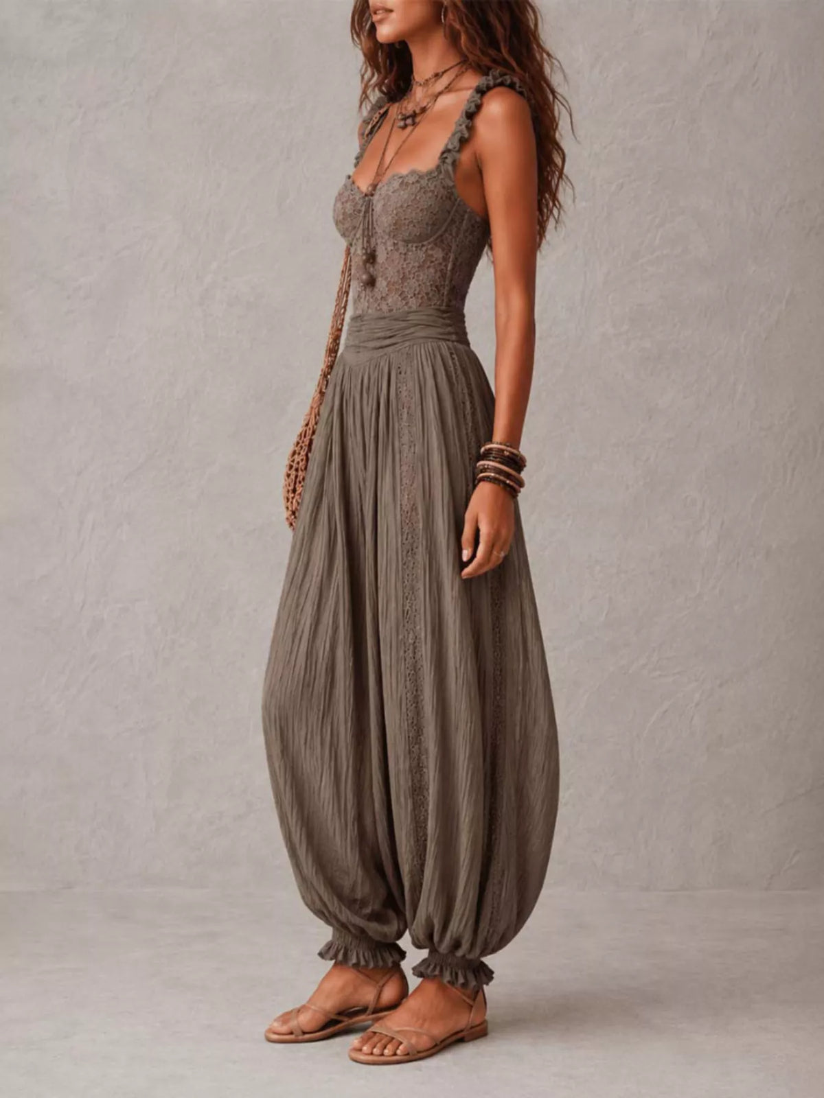 Dark gray lace corset jumpsuit with lace bodice and loose harem trousers