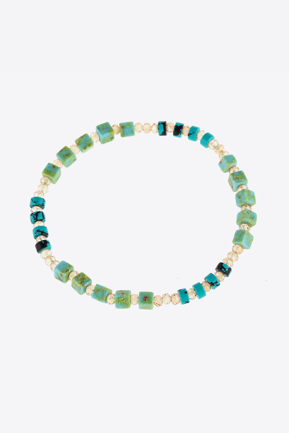 Crystal and natural stone bracelet with teal, light green, and gold bead accents