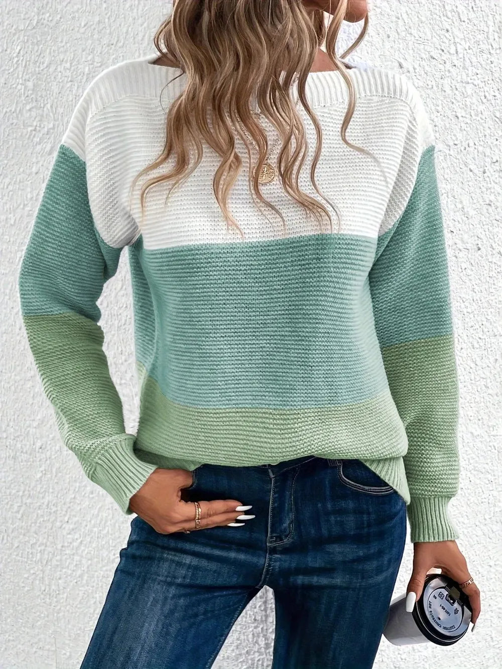 Back view of boat-neck color block sweater in white with mint green and light green bands