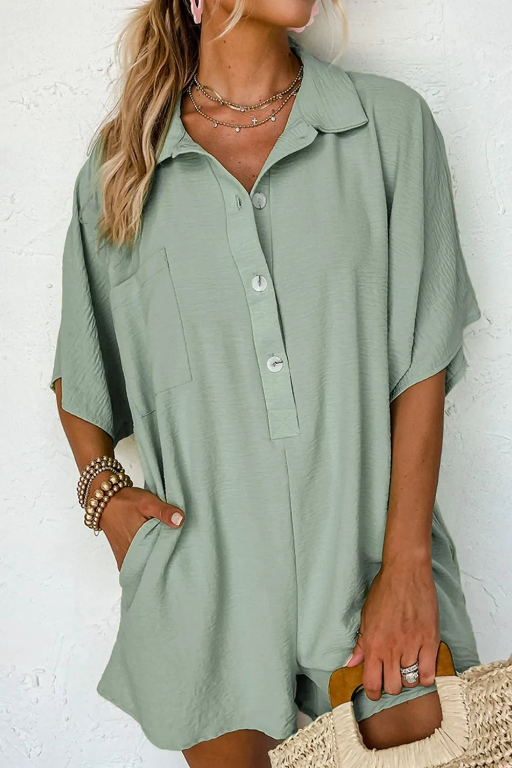Sage collared romper with half-button placket and short sleeves