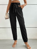 Black tie-front long pants with elastic waistband and large bow-tie at the waist
