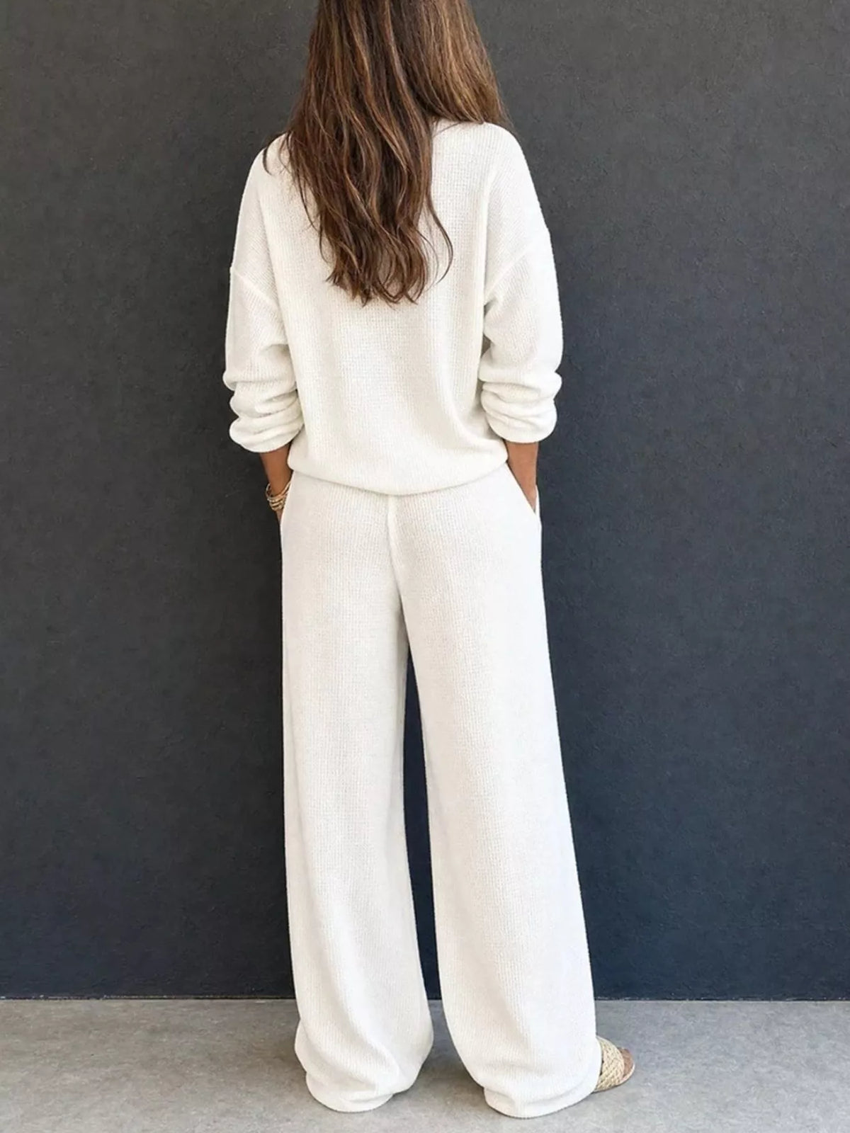 White waffle-knit lounge set with long sleeves and relaxed wide-leg pants, back view.