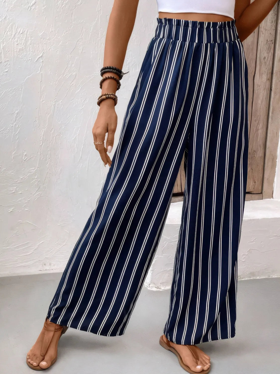 Dark navy striped wide-leg pants with elastic waistband and wide straight legs