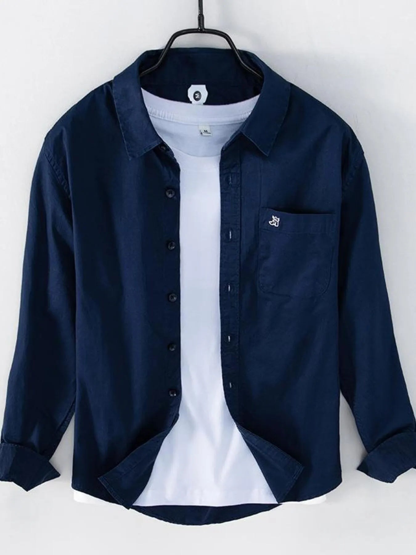 Dark blue long sleeve button-up shirt with chest pocket and button placket