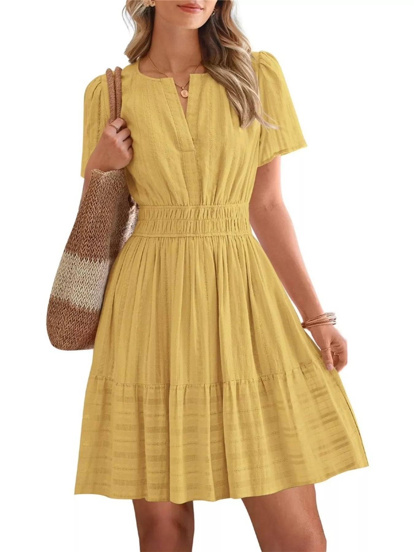 Yellow short-sleeve smocked-waist tiered dress with V-neck and gathered skirt.