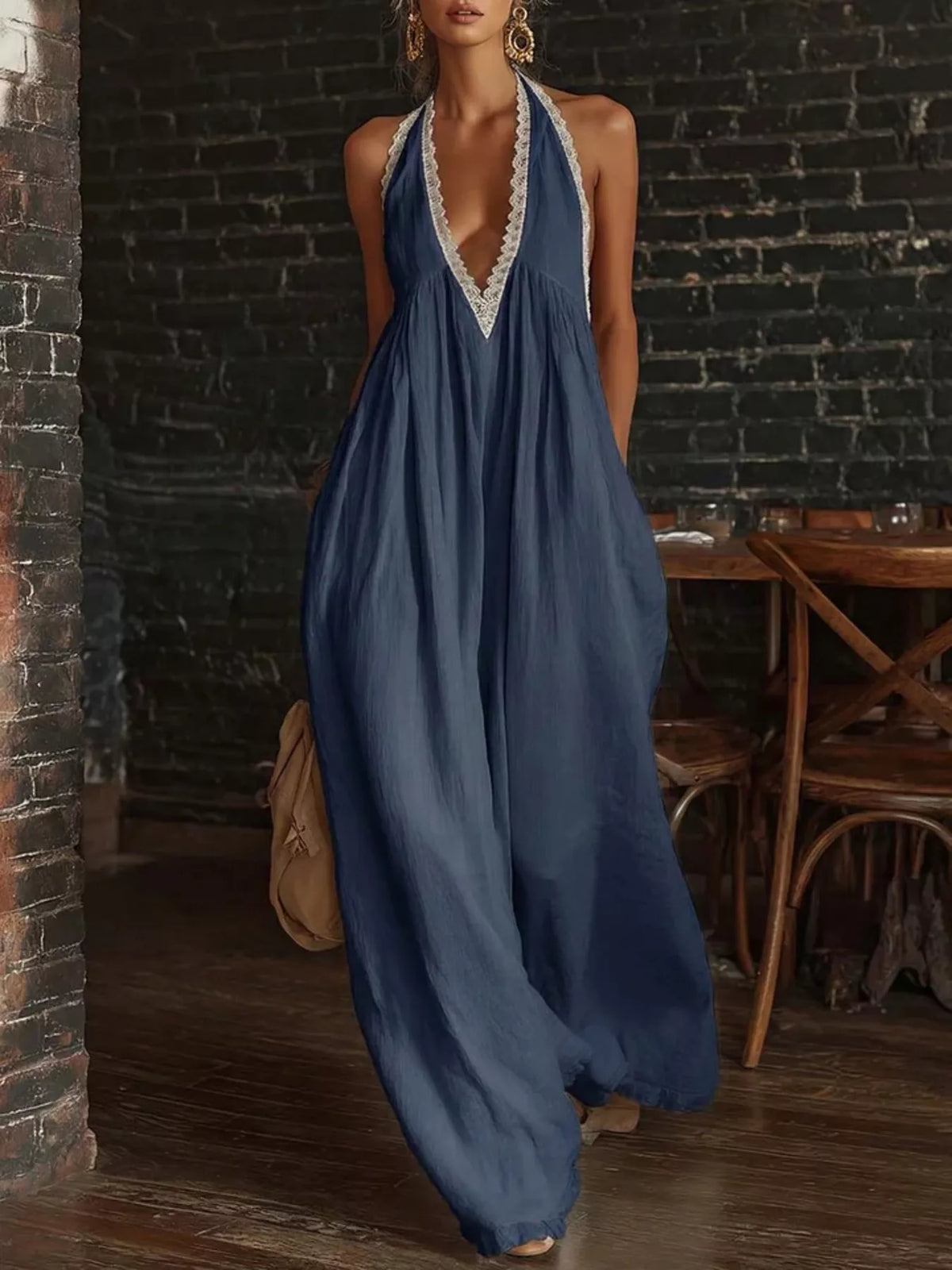 Navy blue halter neck lace-trim wide-leg jumpsuit with deep V neckline and flowing drape