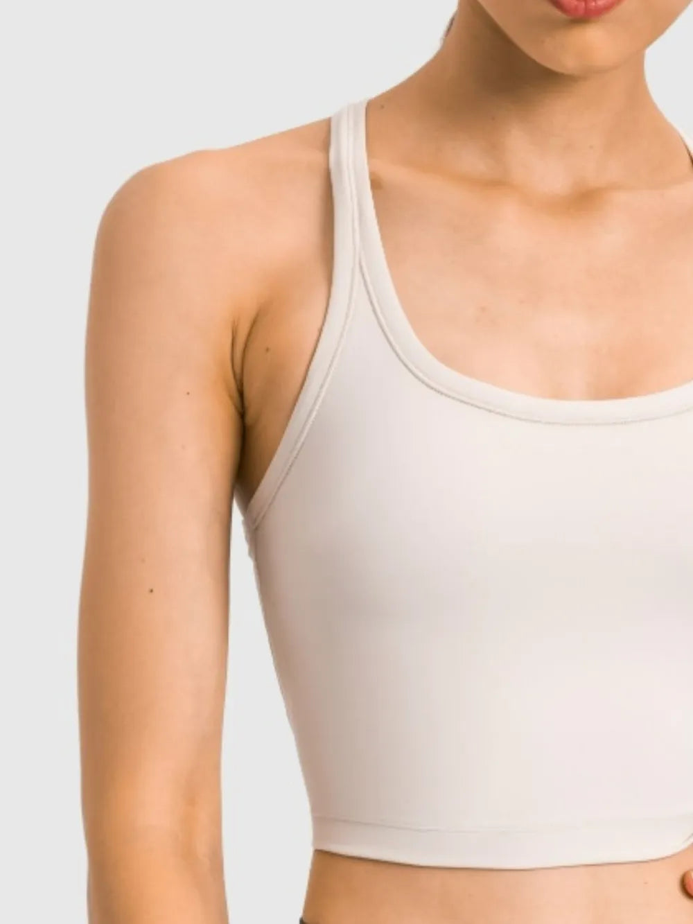 White scoop-neck active tank with racerback straps