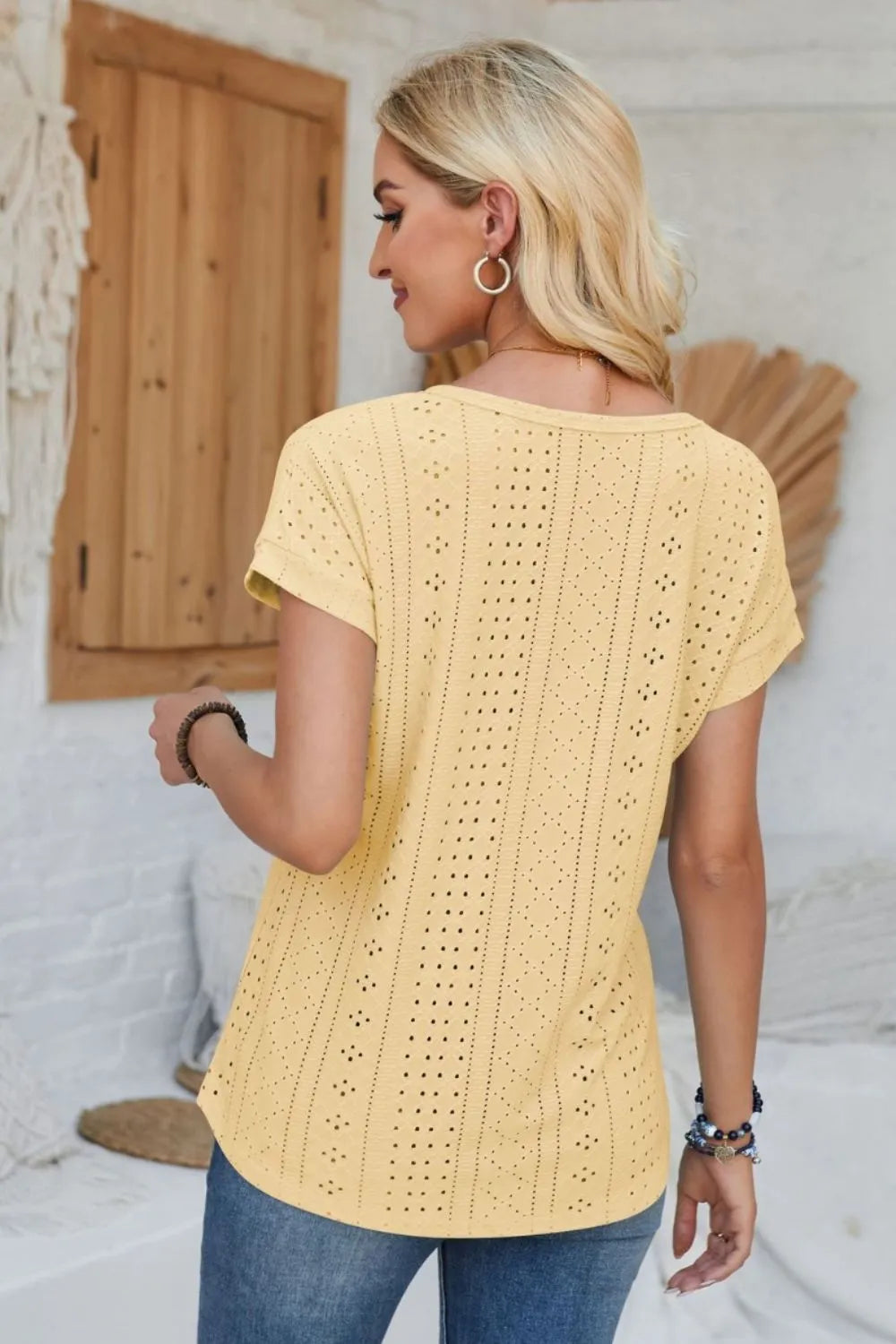 Light yellow eyelet short-sleeve T-shirt with round neck, back view