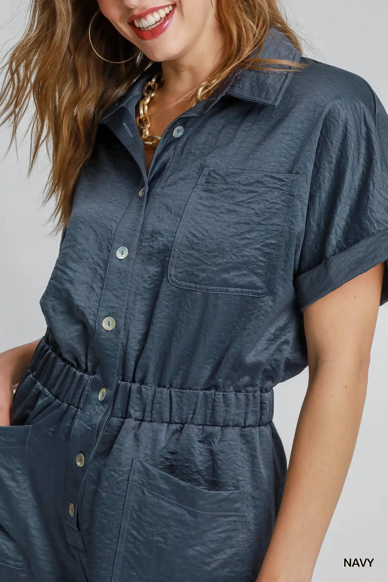 Navy button-front charmeuse romper close-up of collar and buttons at front