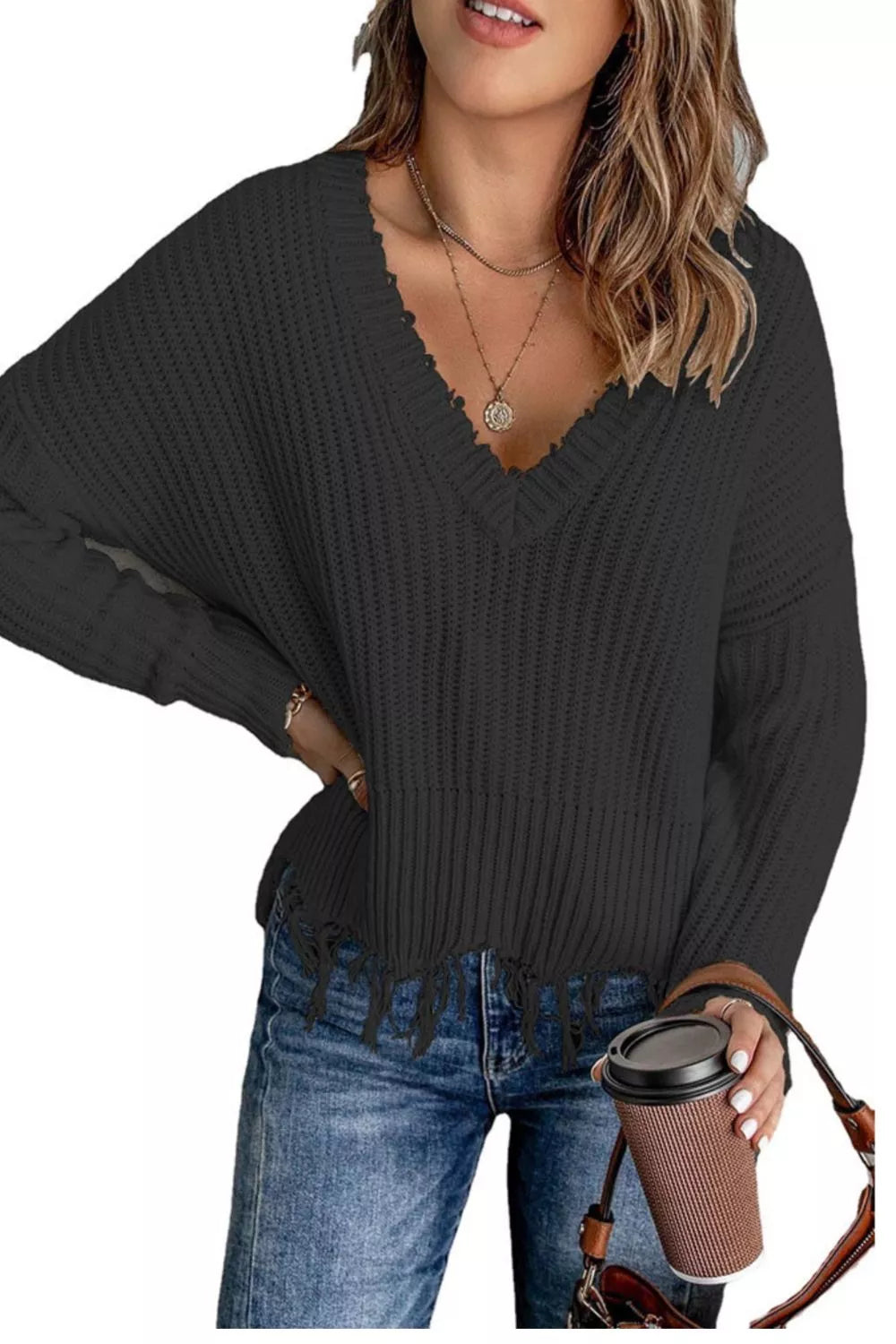 Black V-neck knit sweater with ribbed knit texture and fringe raw hem