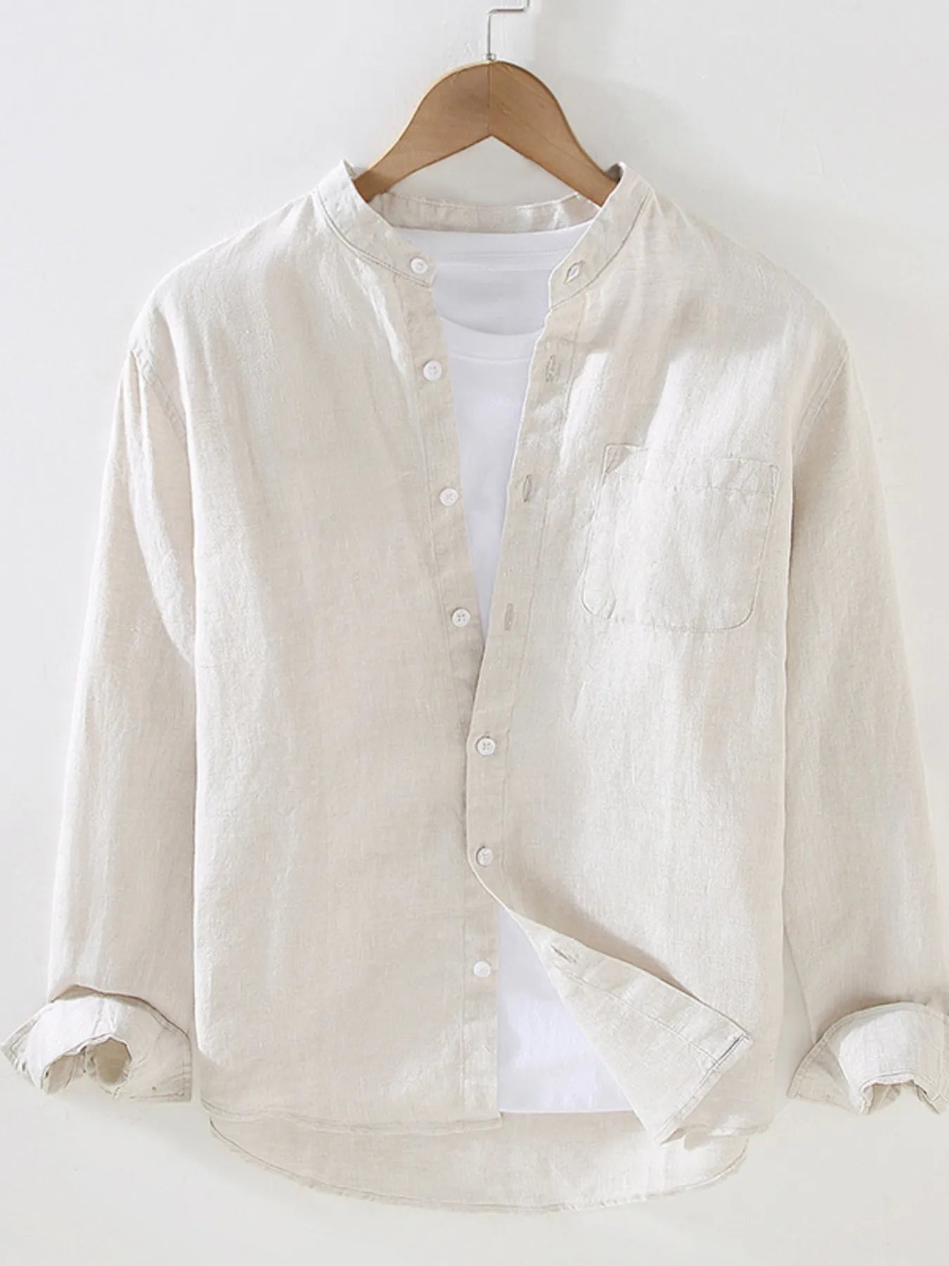 Men's long sleeve button-up shirt in off-white with front buttons and chest pocket