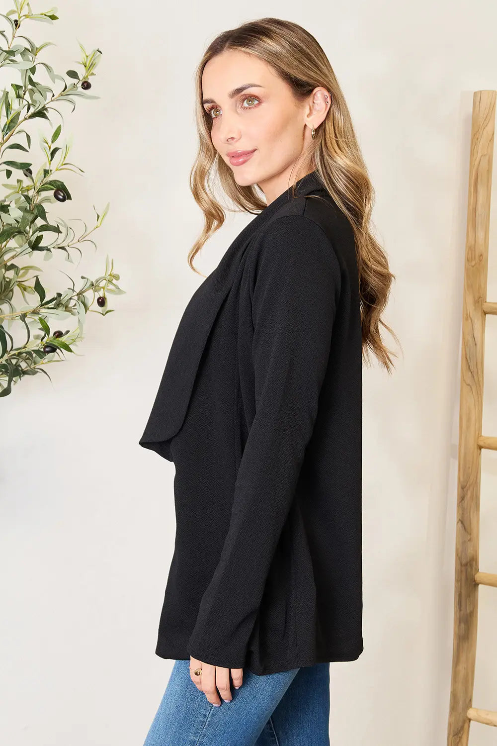 Black long sleeve blazer, open front and relaxed drape with cuffed sleeves