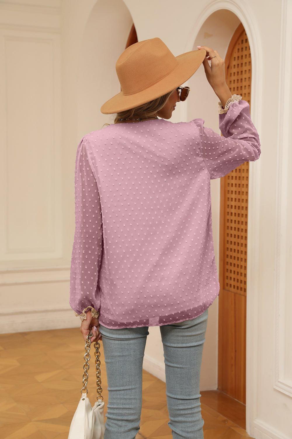 Light mauve swiss-dot V-neck blouse with cream trim on back yoke and cuffs