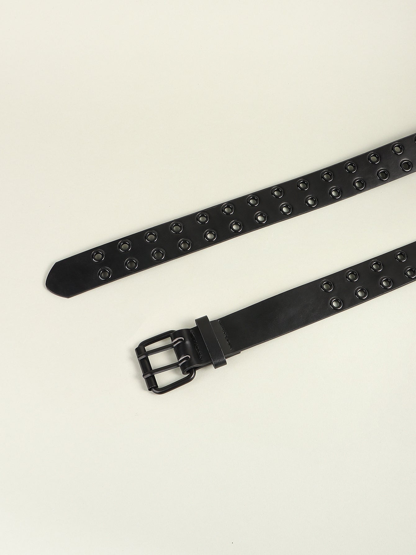 Black wide belt strap with metal grommets and square buckle, laid flat.
