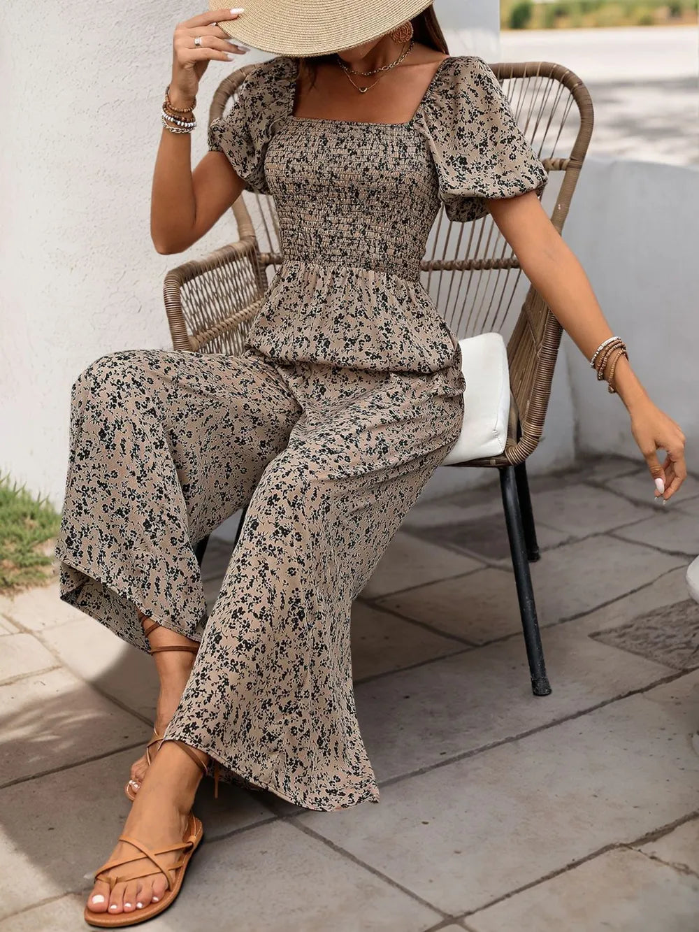 Taupe printed jumpsuit with smocked square neckline, puff sleeves, wide legs