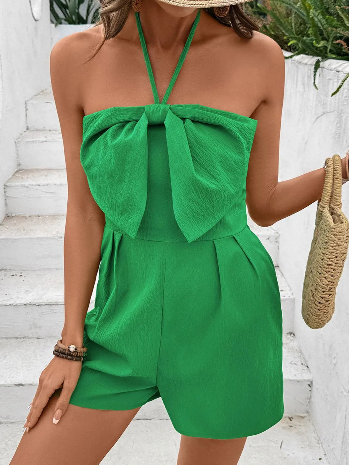 Green bow halter neck smocked romper with smocked bodice and wide front bow