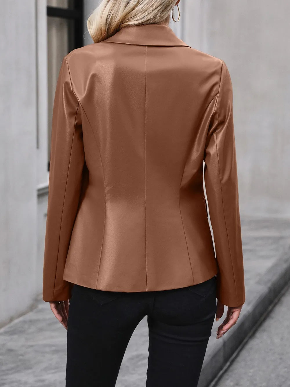 Women’s brown blazer back view with long sleeves and tailored seams