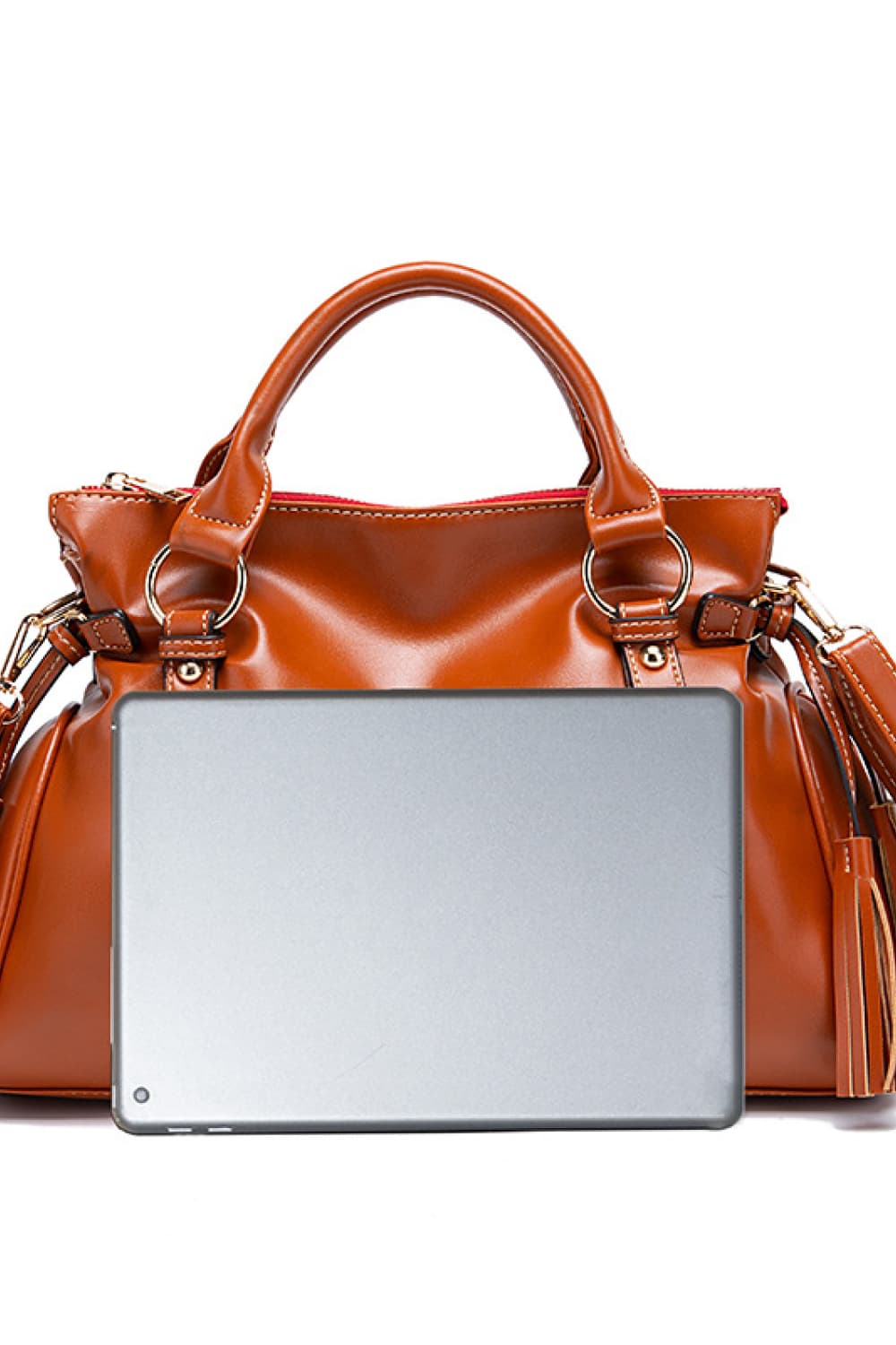 PU leather handbag in brown with tassel sides, zip top, and rectangular insert shown.