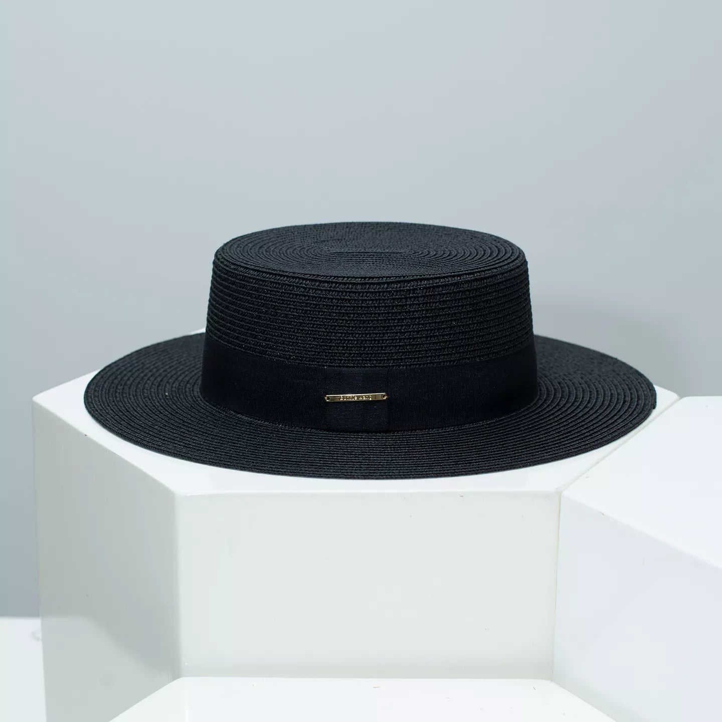 Cedar & Moore straw boater hat with black band by Trendsi.