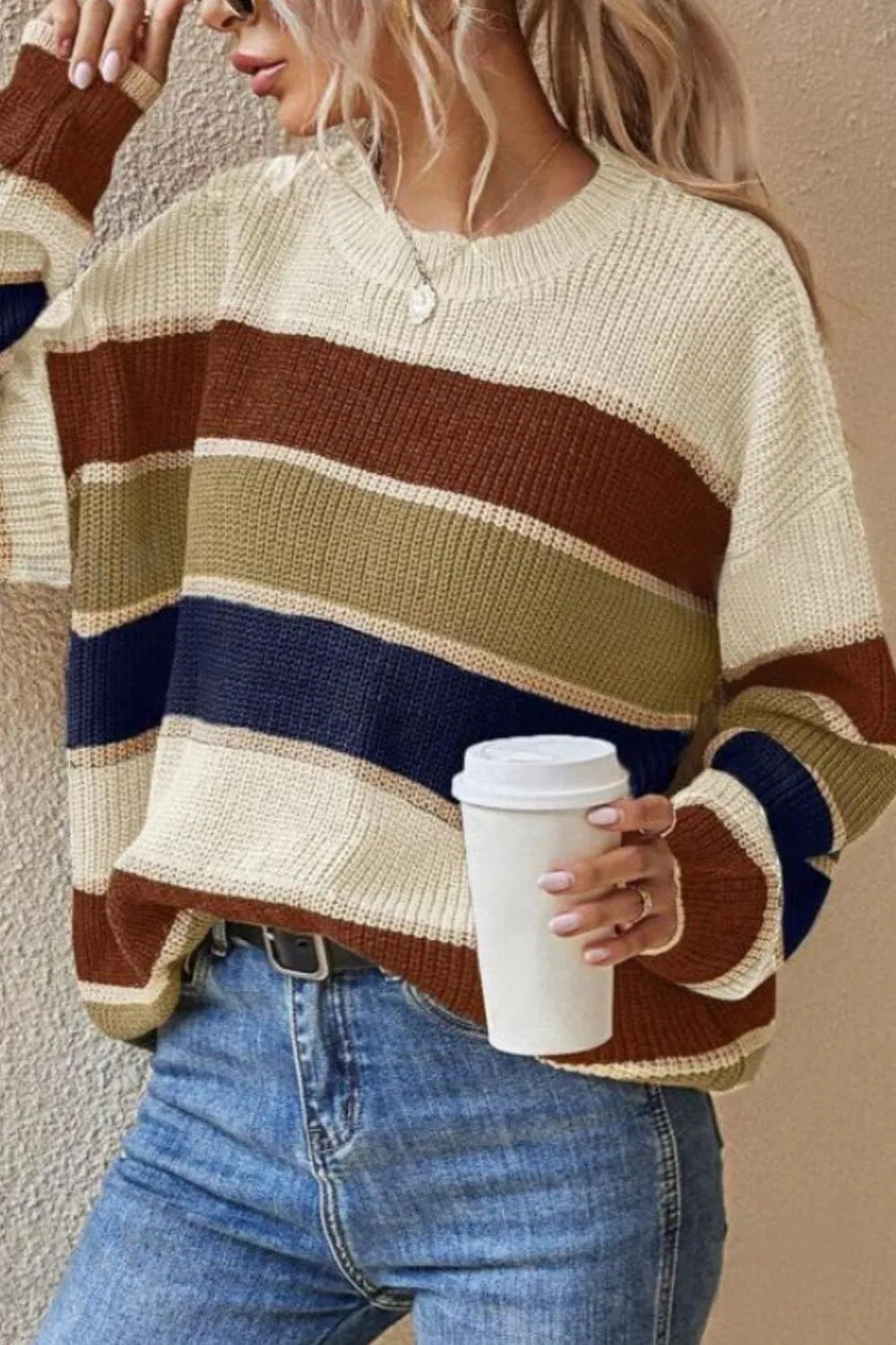 Striped round-neck long-sleeve sweater in cream with brown, navy, and tan block stripes