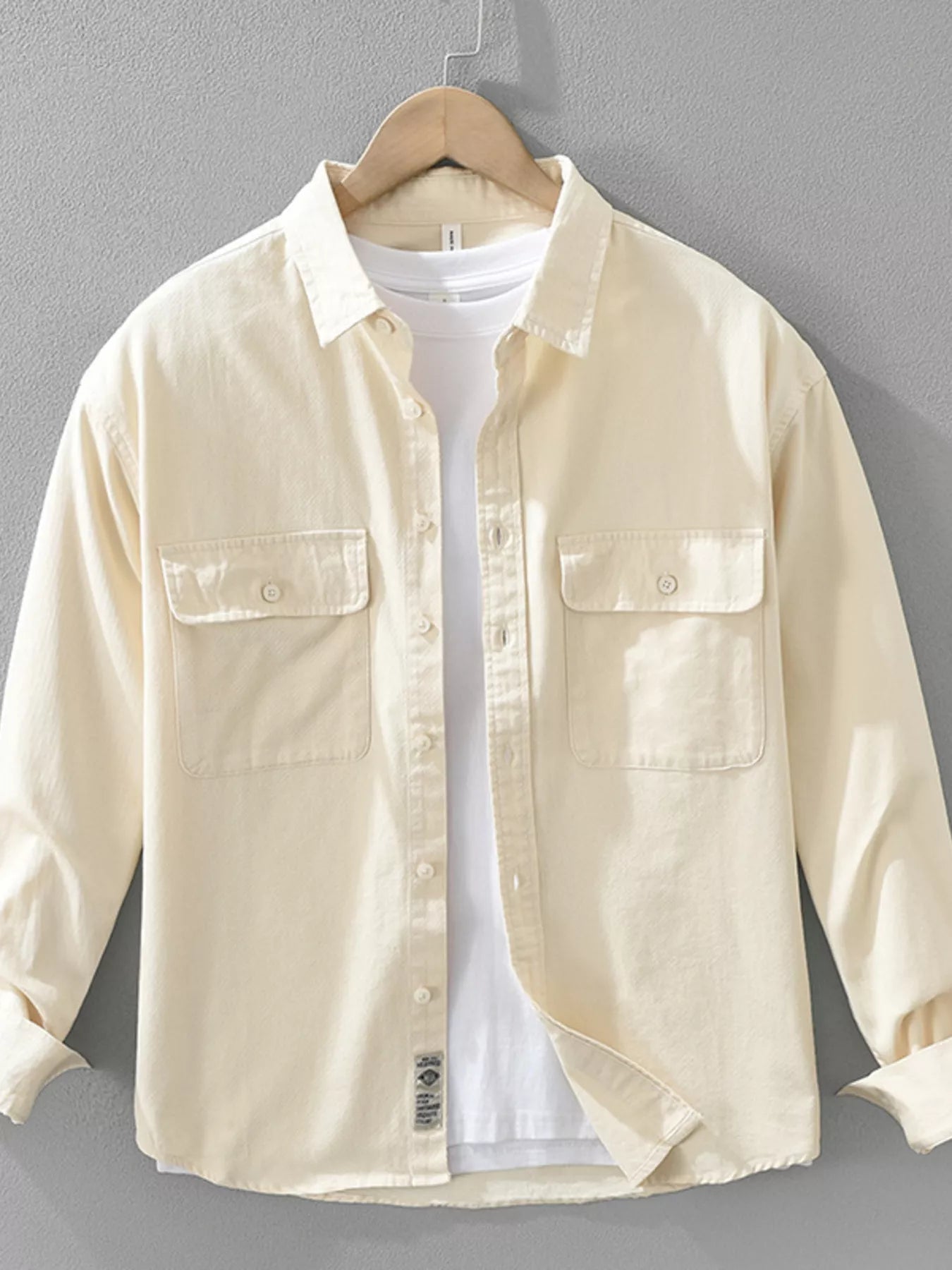 Cream plus size button-up long sleeve shirt with two chest pockets