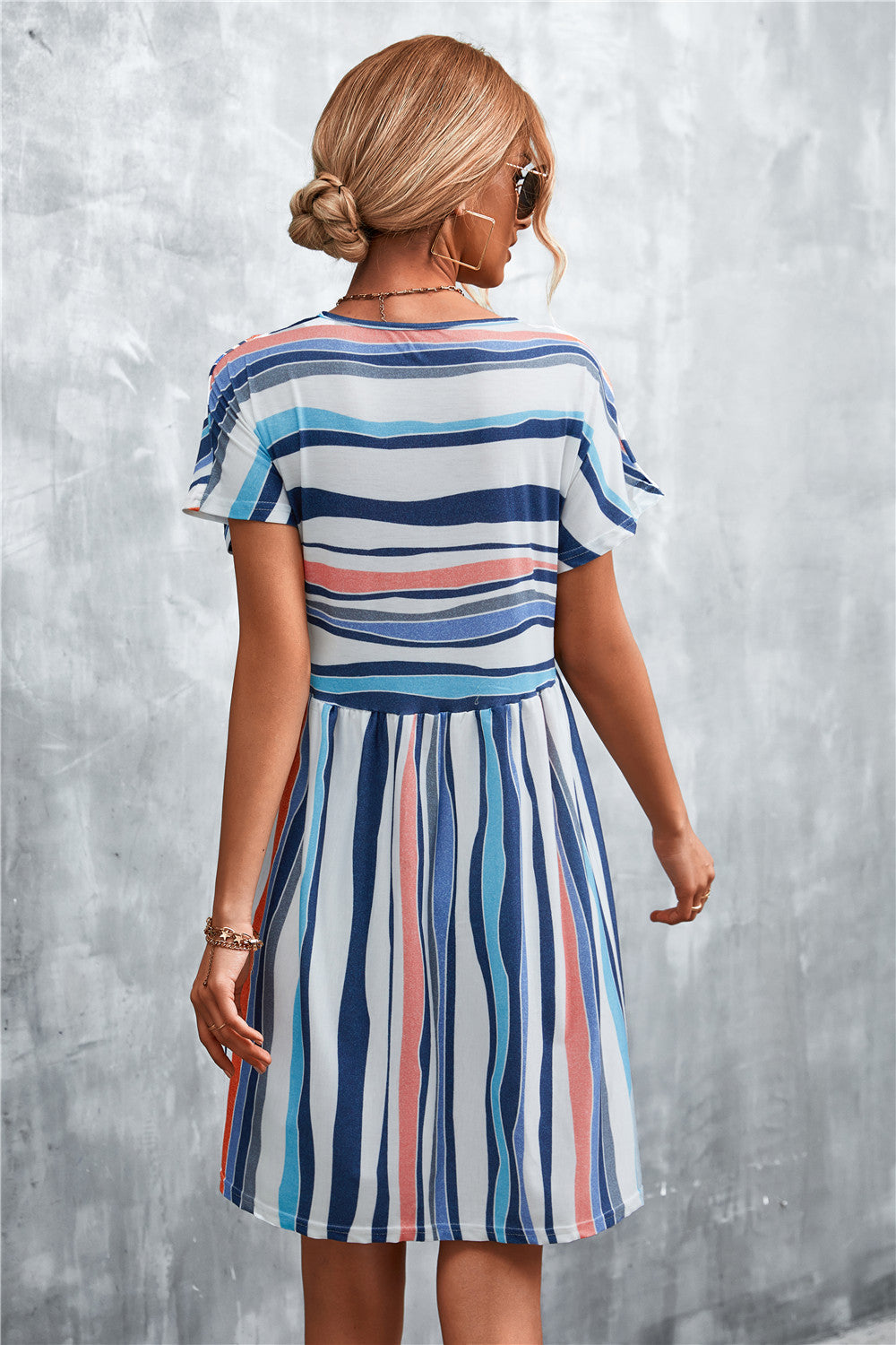 Striped round-neck dress, back view, short flutter sleeves, blue and coral vertical stripes