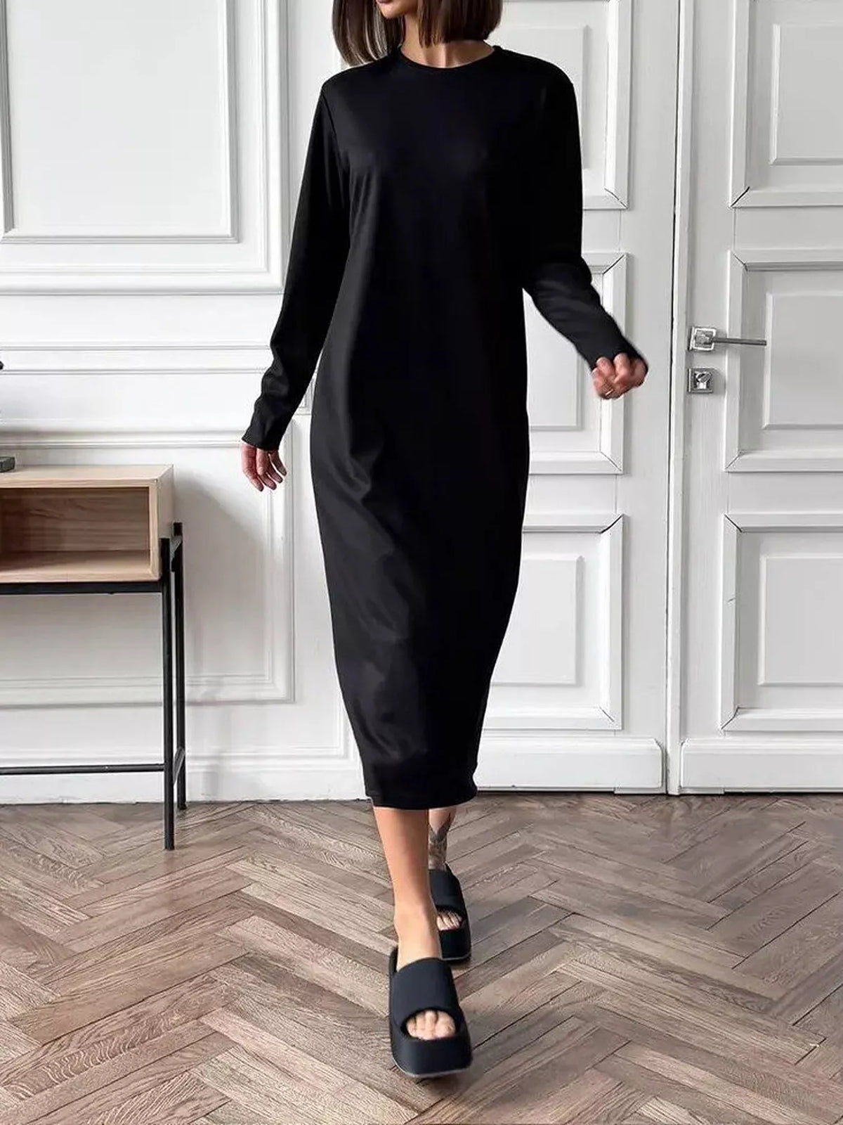 Women's black round-neck long-sleeve midi dress, front view