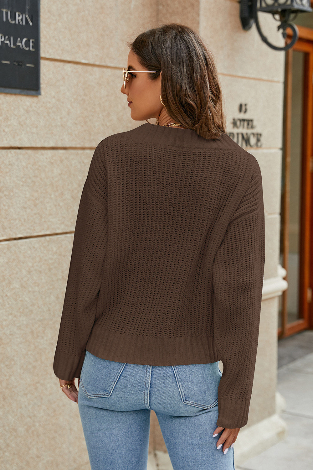 Brown openwork knit surplice sweater, long sleeves in back view