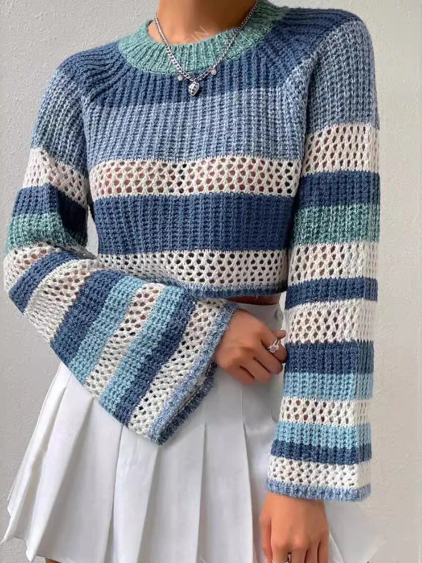 Striped color block crop sweater with openwork knit and ribbed crew neckline