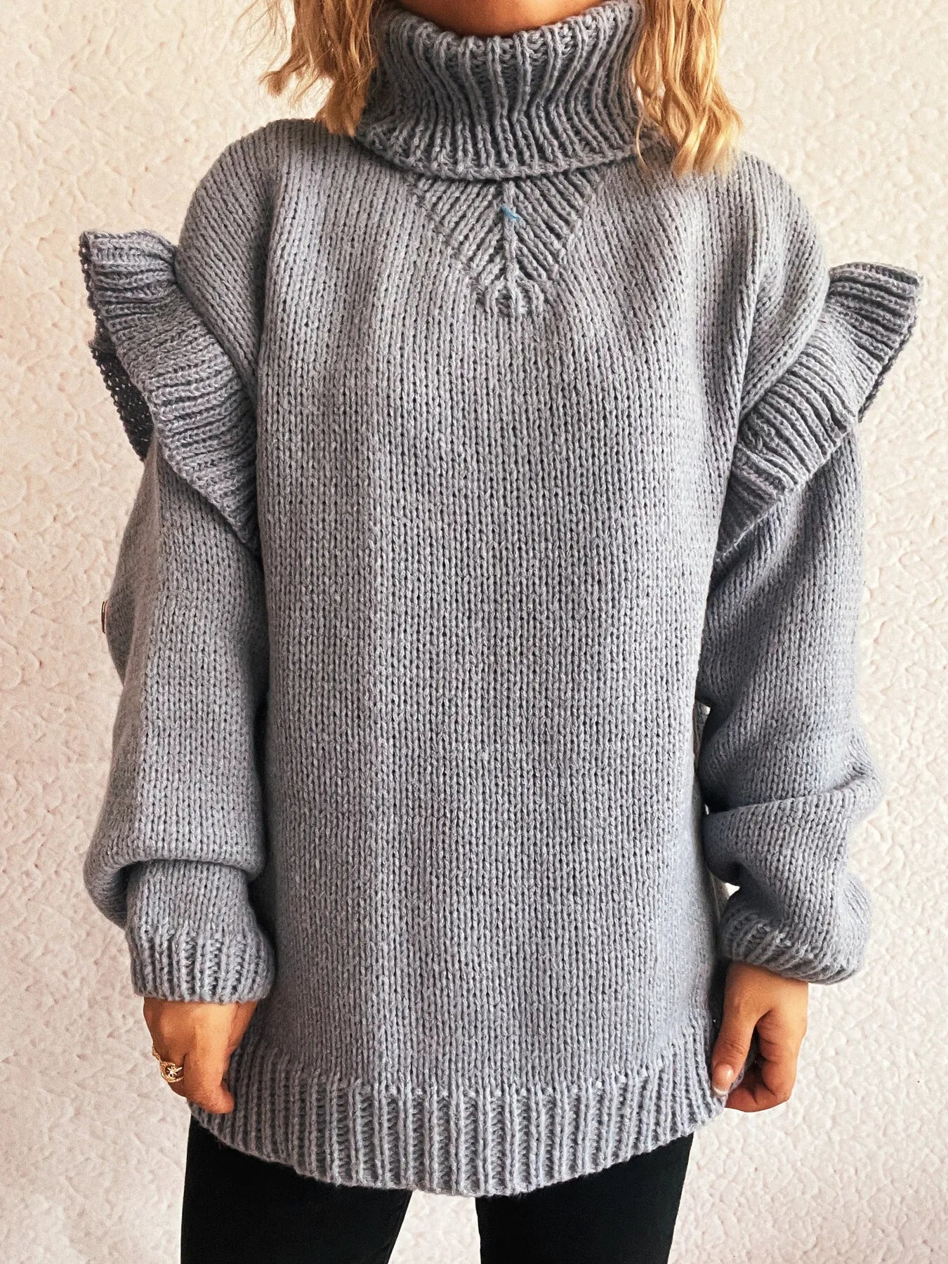 Grey ruffled turtleneck long-sleeve knit sweater with vertical cable detail