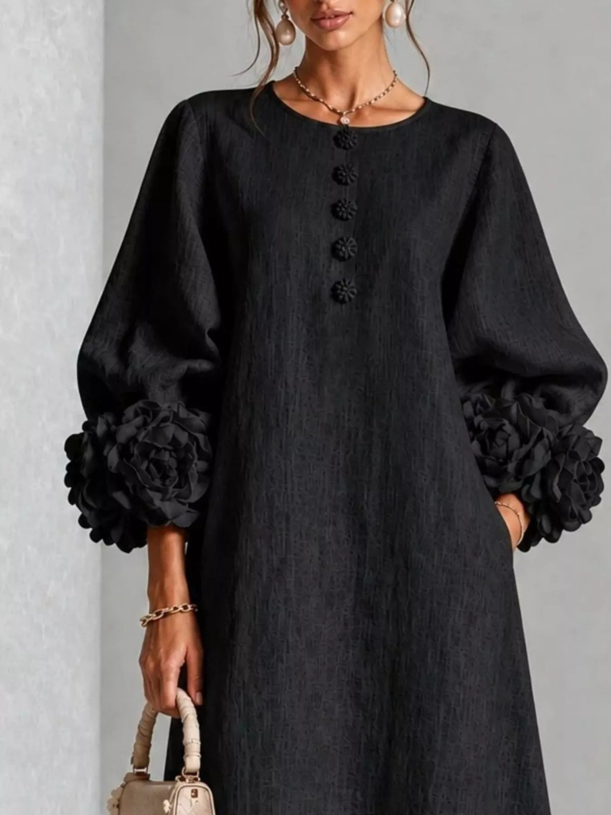 Black midi dress with round neck, button front, and 3D floral puff sleeves