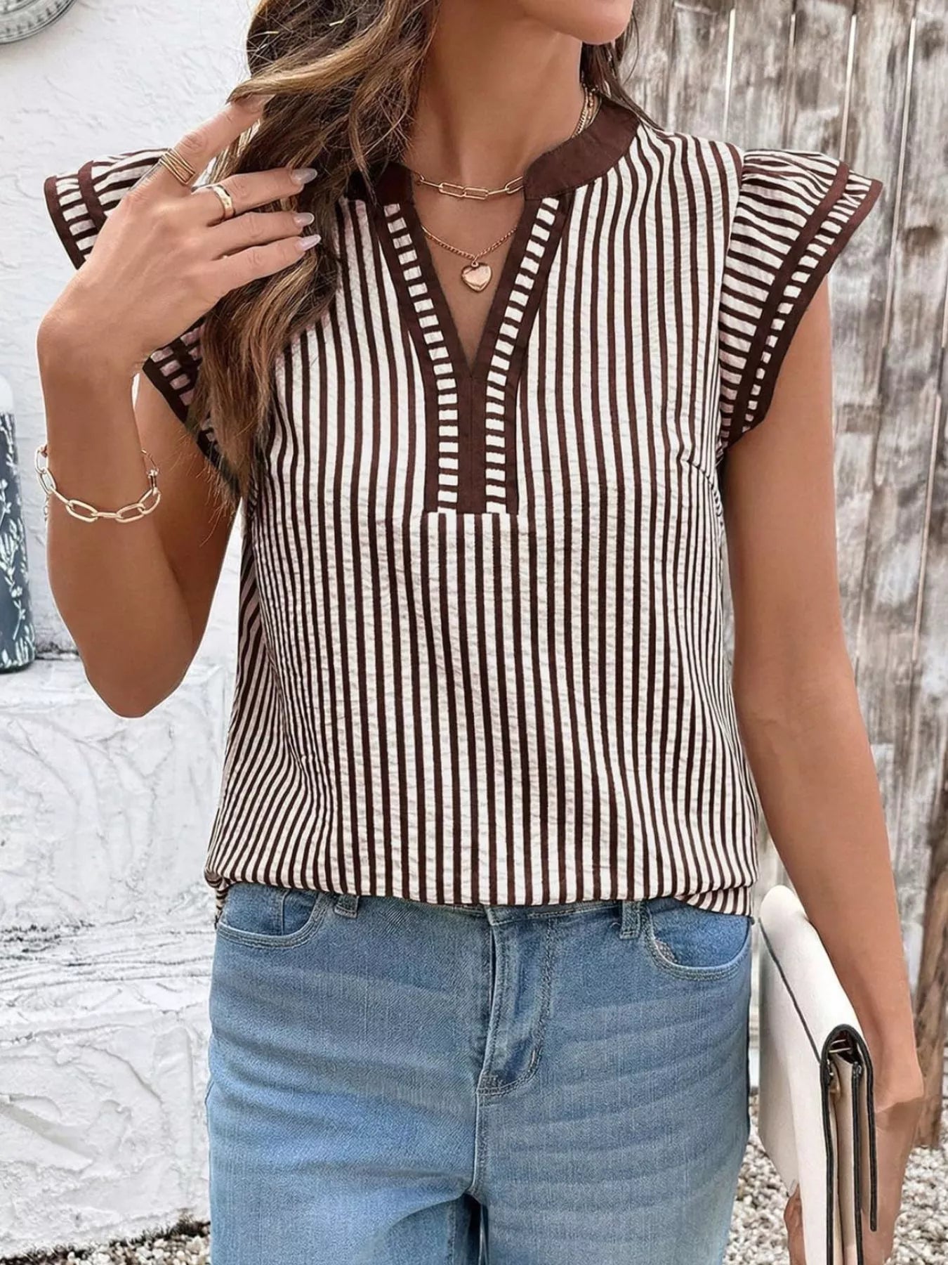 Striped ruffle-sleeve blouse, brown and white vertical stripes with brown trim, by Trendsi