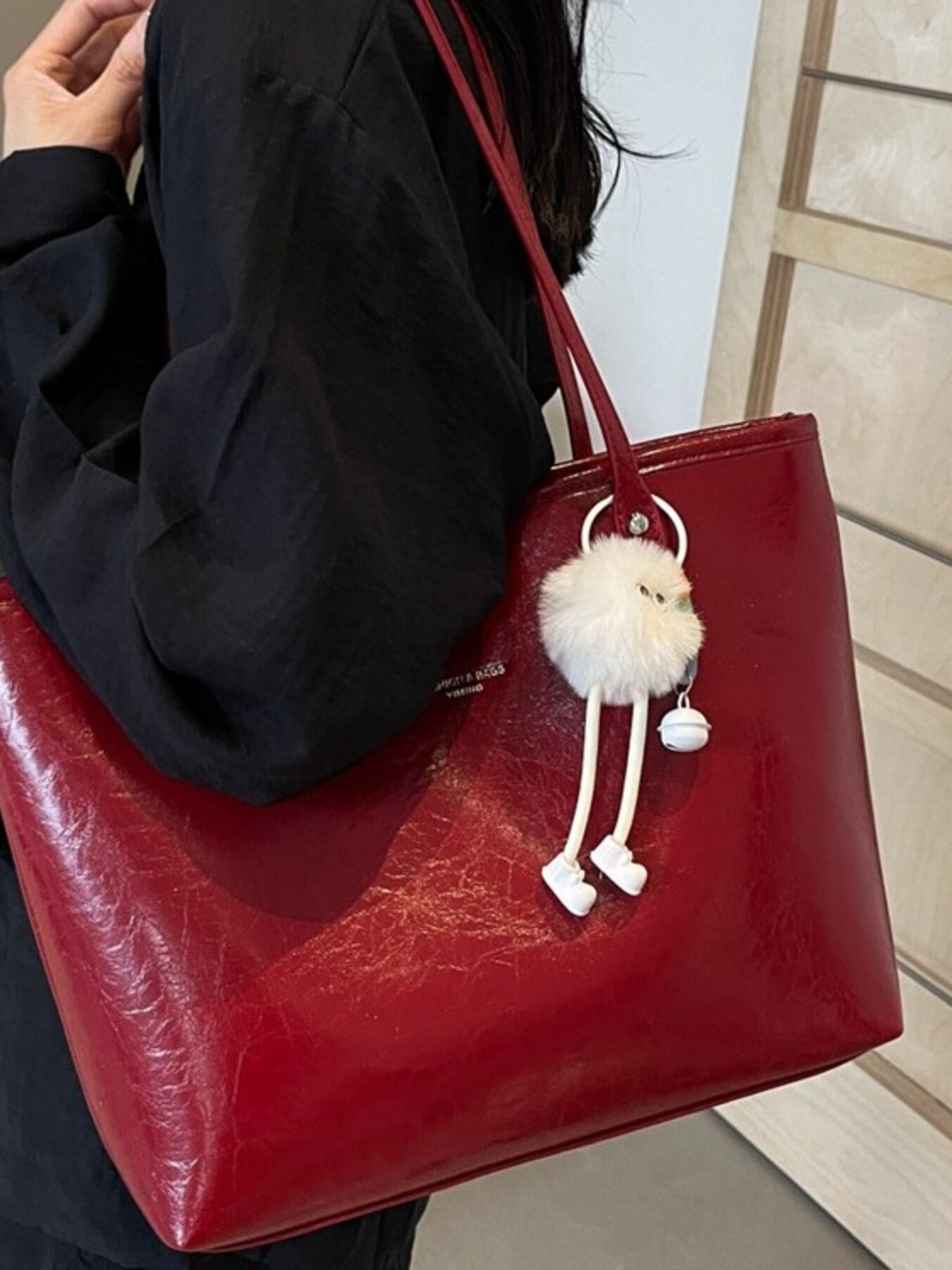 Faux Leather Shoulder Bag, red PU, large size with white fluffy pom-pom keychain.