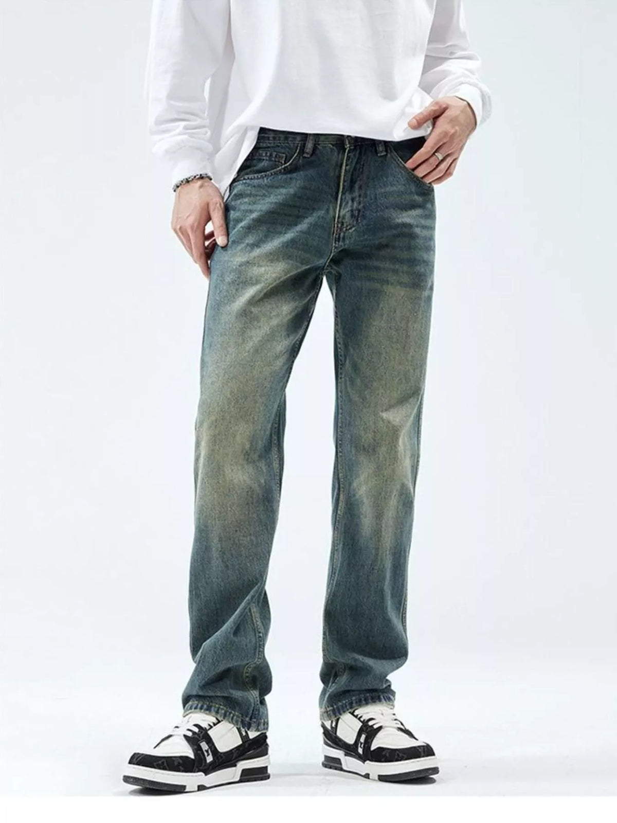 Men's slim-fit washed stretch jeans in vintage blue, front view with cuffed hem