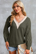 Army green V-neck sweater with cream contrast neckline and long puff sleeves