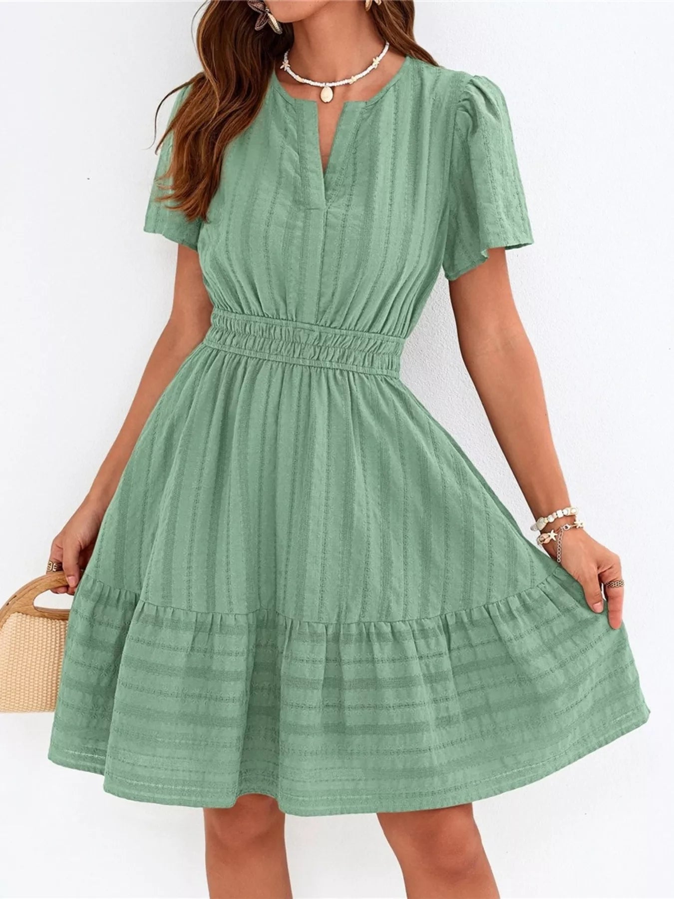 Mint green short-sleeve tiered dress with smocked waist and V-neck