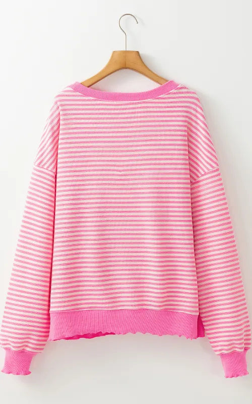 Pink and white striped long-sleeve sweatshirt hanging on a hanger, round neck