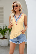 Light yellow contrast V-neck eyelet tank top with blue-pink trim and V-shaped neckline