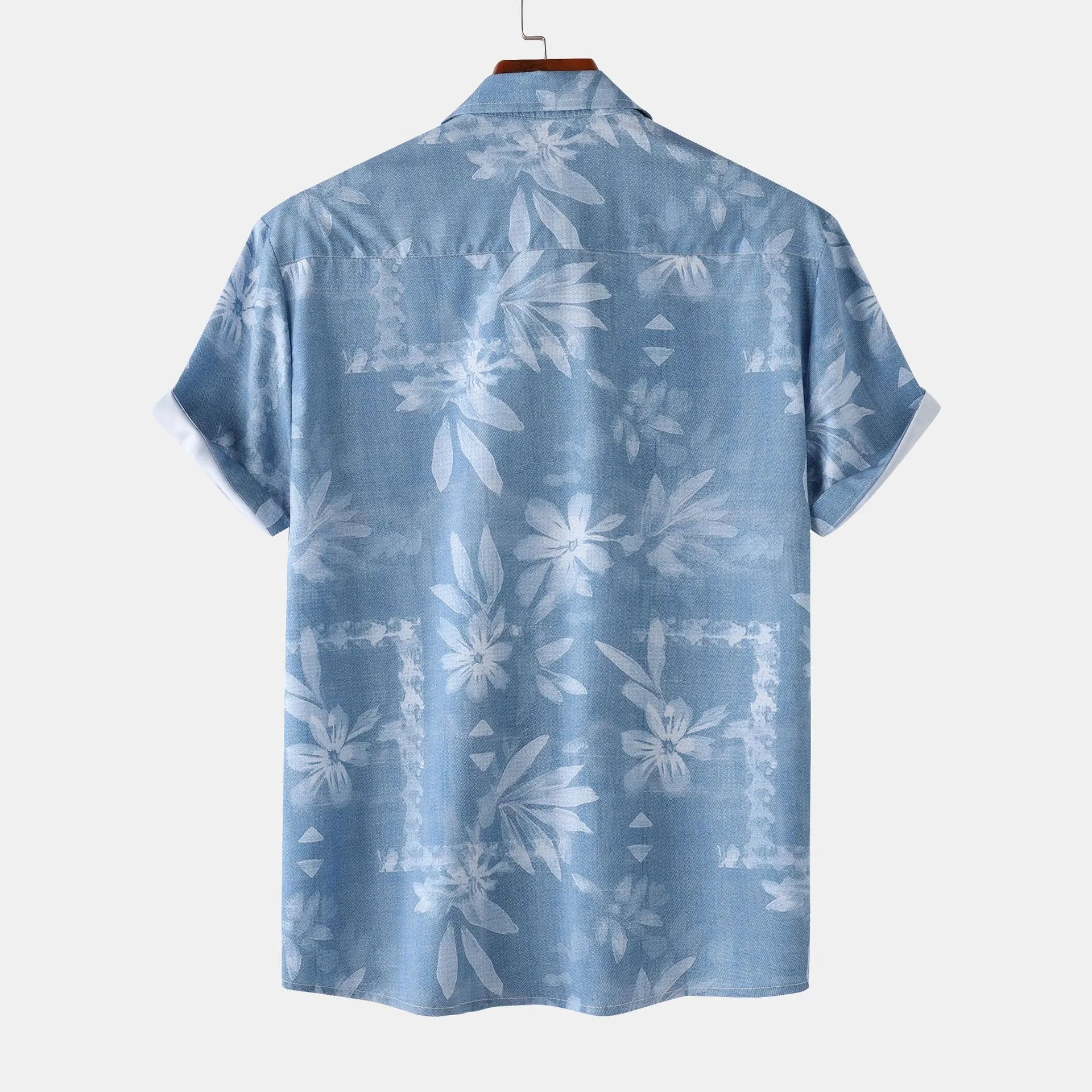 Men’s printed short-sleeve button-up shirt in blue with back view floral leaf pattern.