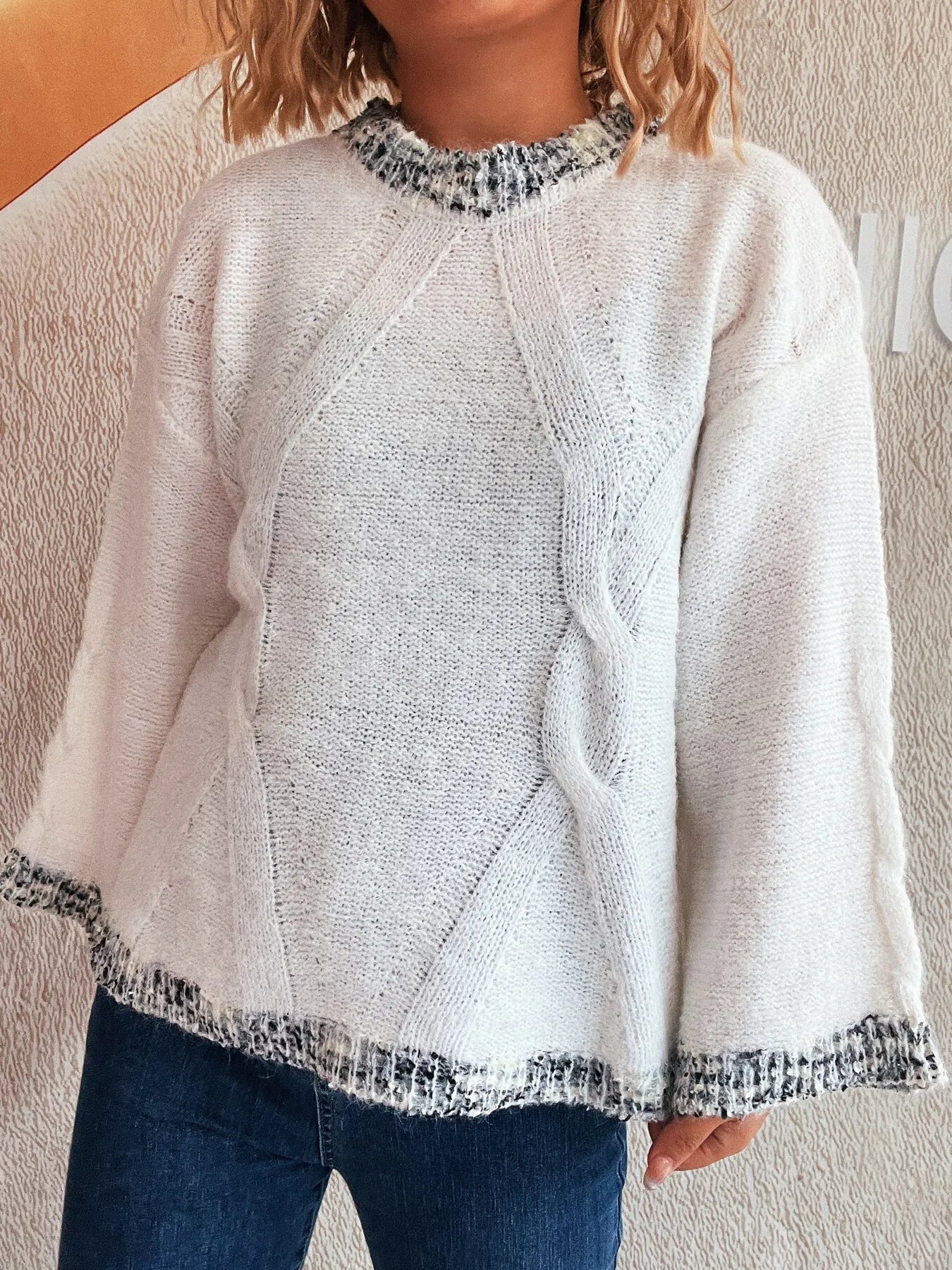 White round-neck sweater with contrast trim at hem and sleeve cuffs