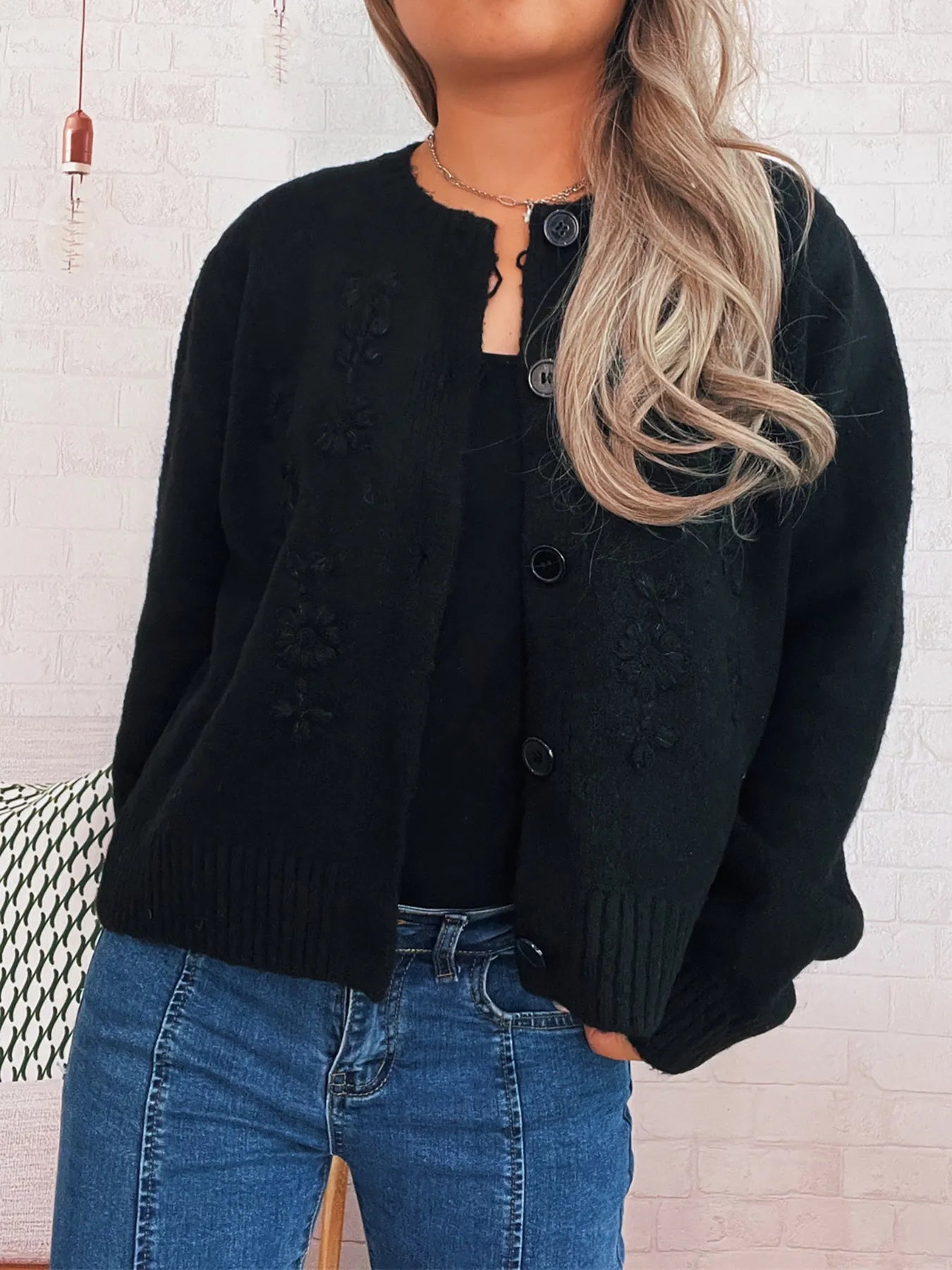 Black cardigan with flower embroidery, ribbed hem and cuffs, button front, long sleeves.