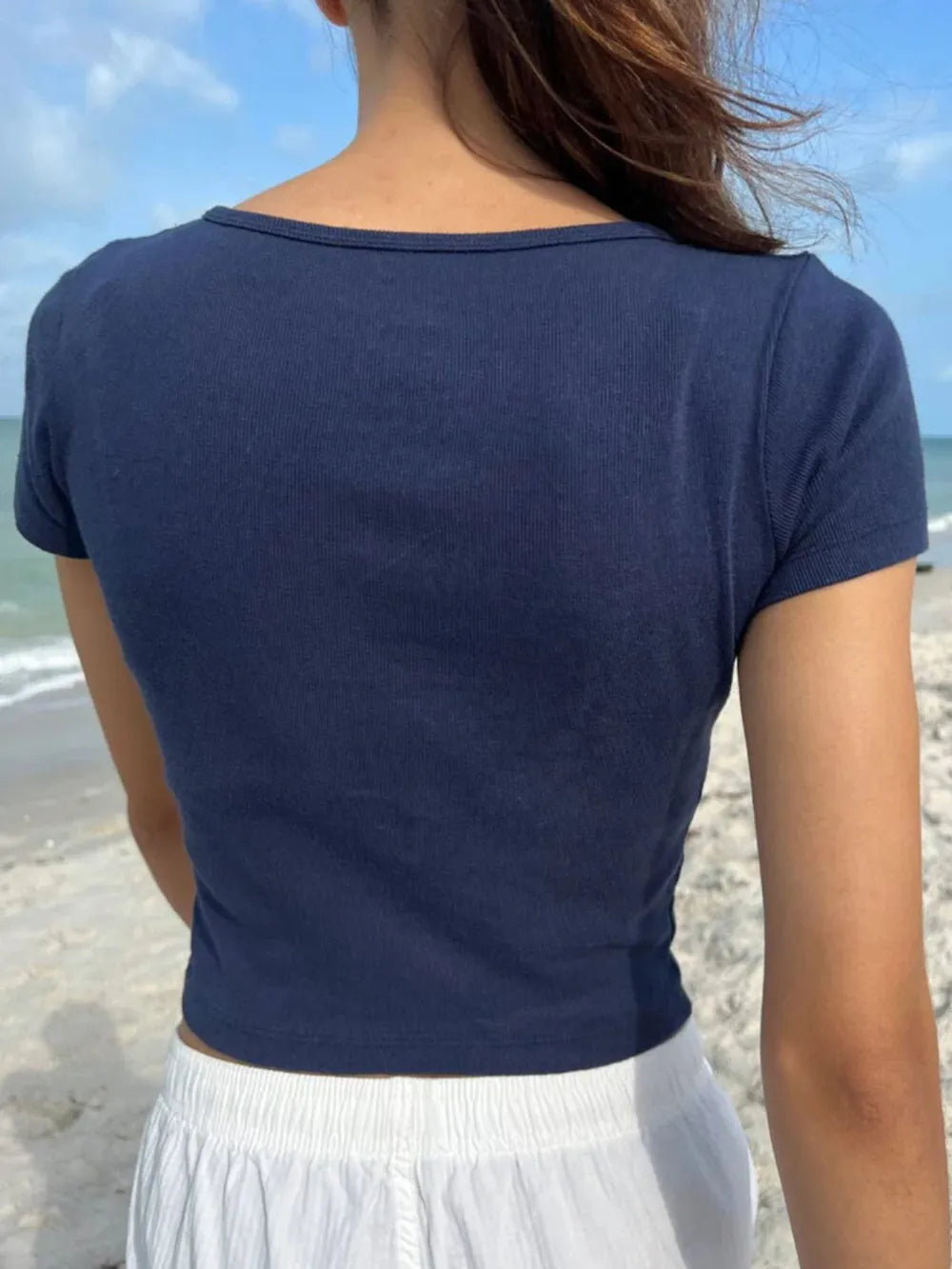 Dark blue button-detail short-sleeve T-shirt, back view with ribbed neckline