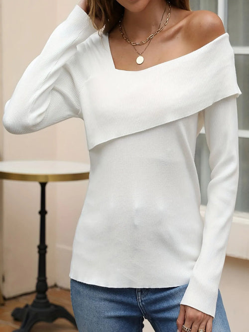 White asymmetrical one-shoulder knit top with long sleeves and folded neckline.
