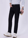 Black slim-fit jeans with belt loops, button closure, and front slash pockets