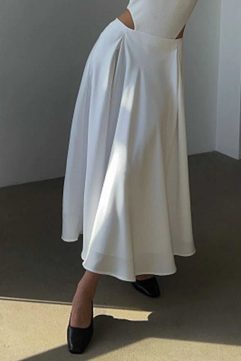 White satin midi skirt with elastic back waist, gathered top and flared silhouette