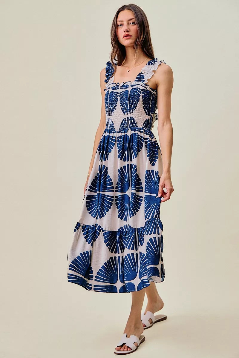Smocked bodice tiered midi dress with navy abstract print on white, sleeveless