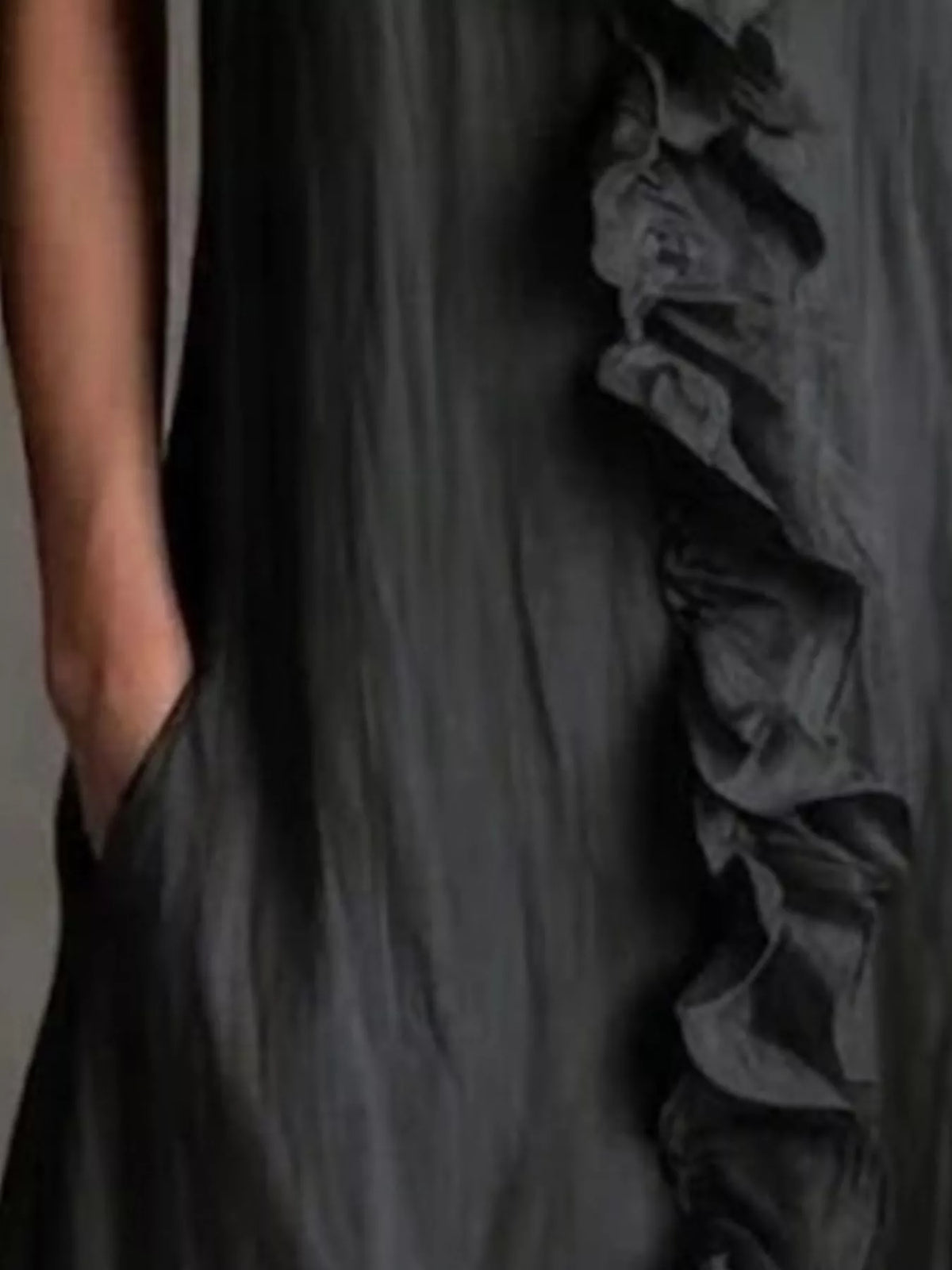 Black sleeveless V-neck ruffle midi dress close-up of front detail
