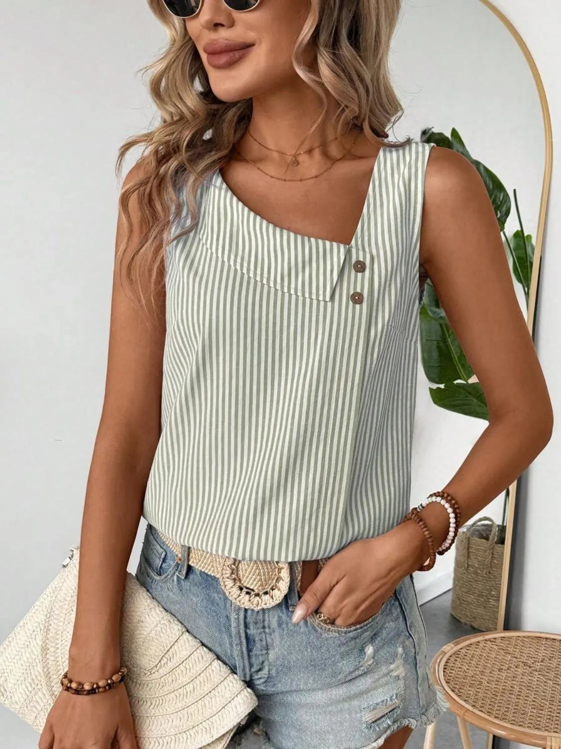 Light blue and white striped tank top with V-neck style and button placket at center